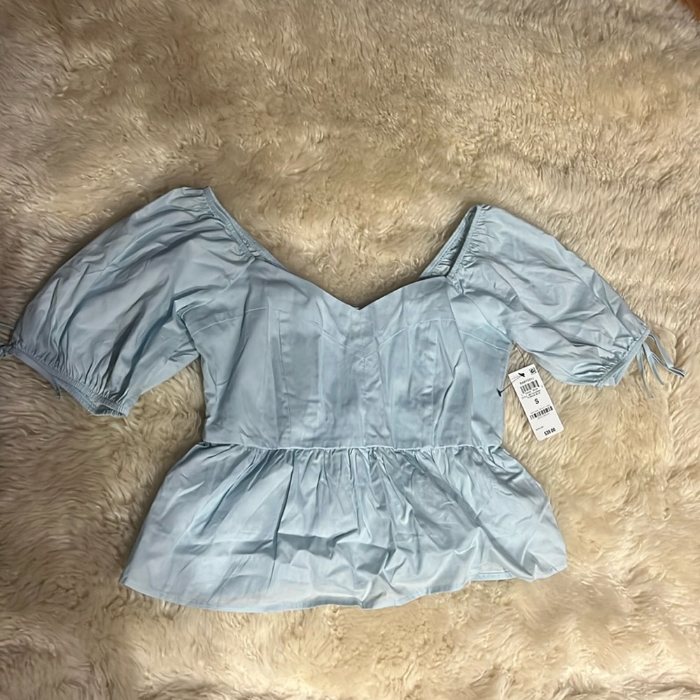 NWT size small and now this light blue blouse